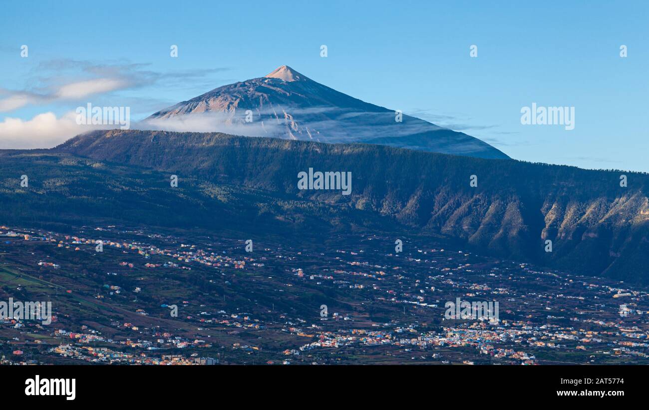 view across valley and Orotava to mount Pico del Teide mountain tenerife Stock Photo