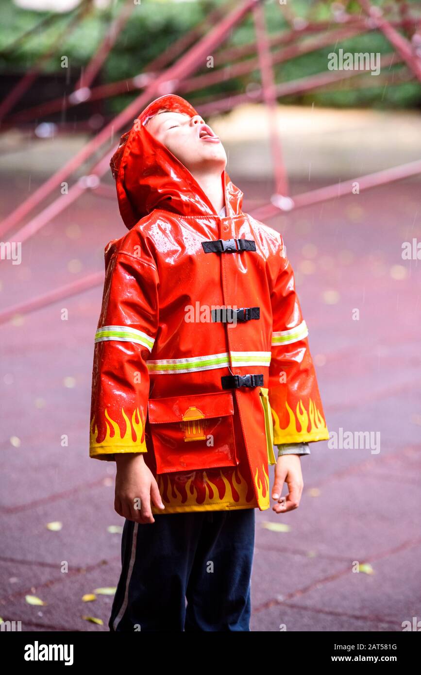 Red raincoat hi-res stock photography and images - Alamy