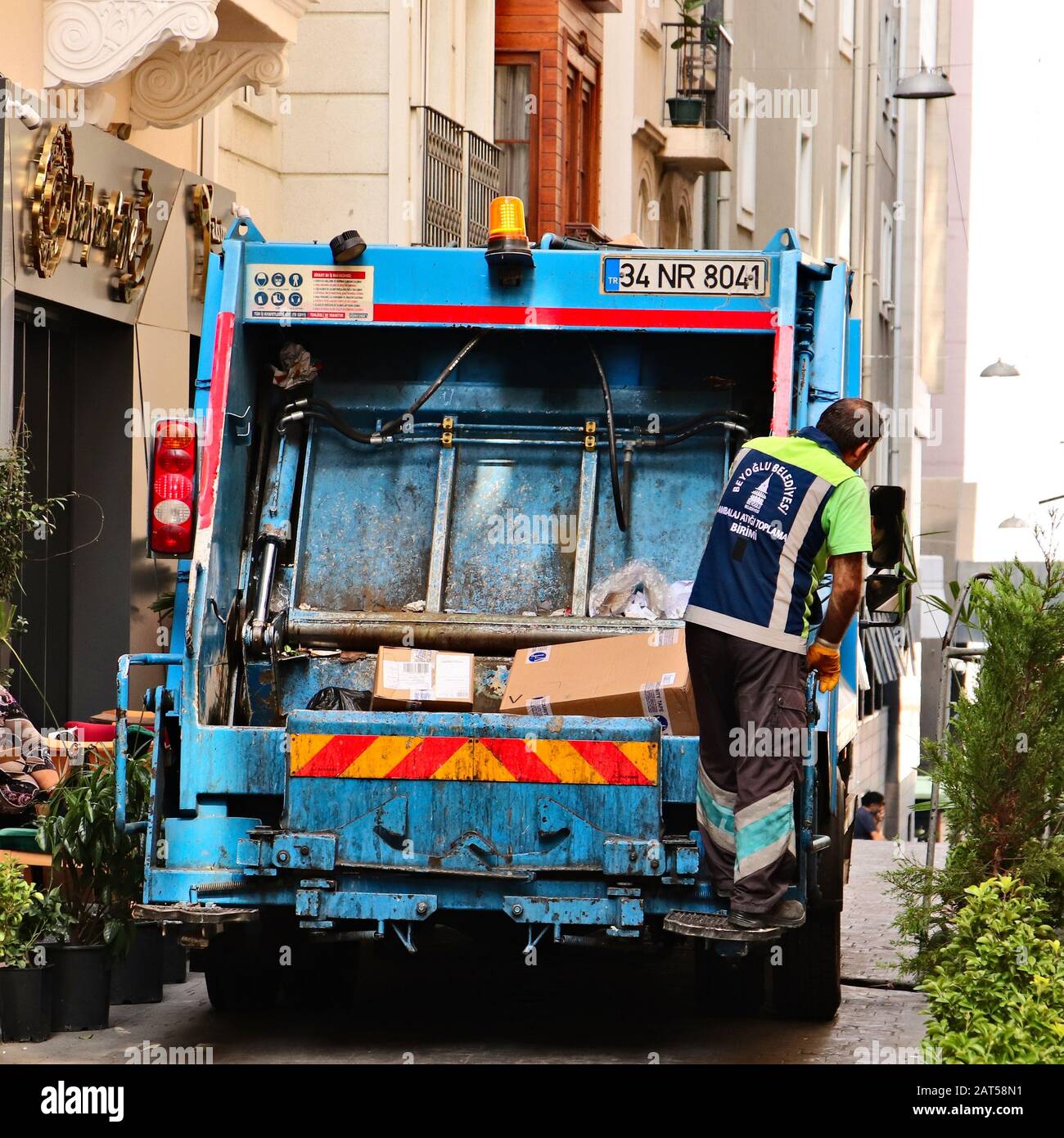 ISTANBUL, TURKEY - Sep 16, 2019: A garbage collection truck and bin man keeping the streets clean. Waste management concept image. Stock Photo
