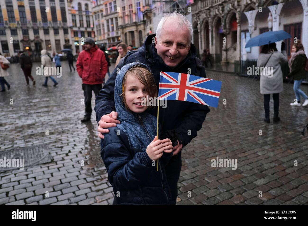 Brussels, Belgium. 30th Jan, 2020. A man holds a European flag and a Union Jack flag on the Grand Place during an event to underline its long friendship with the British. Credit: ALEXANDROS MICHAILIDIS/Alamy Live News Stock Photo