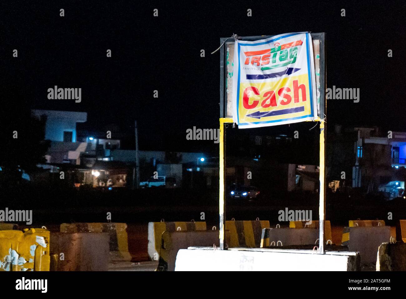 Board seperating the fastag and cash lanes on an indian highway toll ...