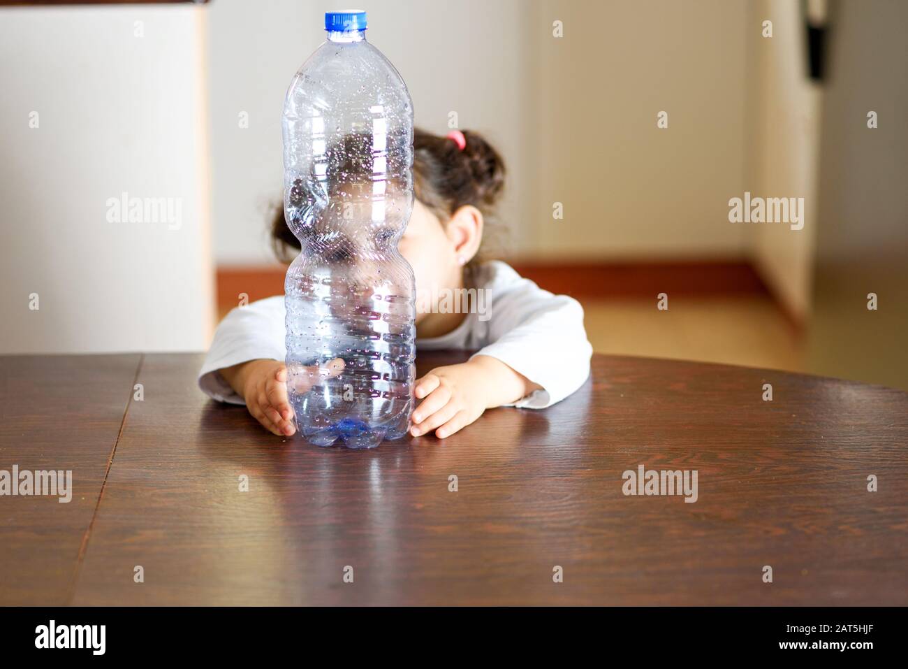 https://c8.alamy.com/comp/2AT5HJF/child-holding-plastic-bottle-concept-of-awareness-of-the-plastic-pollution-world-the-future-for-our-children-2AT5HJF.jpg