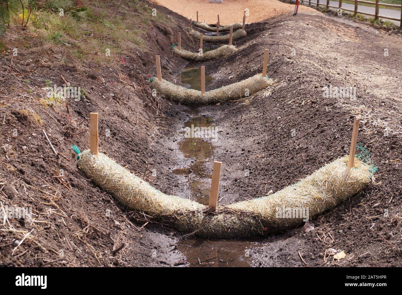 Land drainage works. The use of straw wattles. Stock Photo