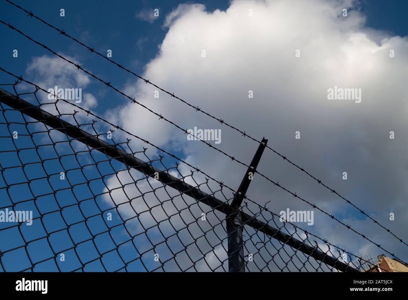 blocked off area with barbed wire fence Stock Photo