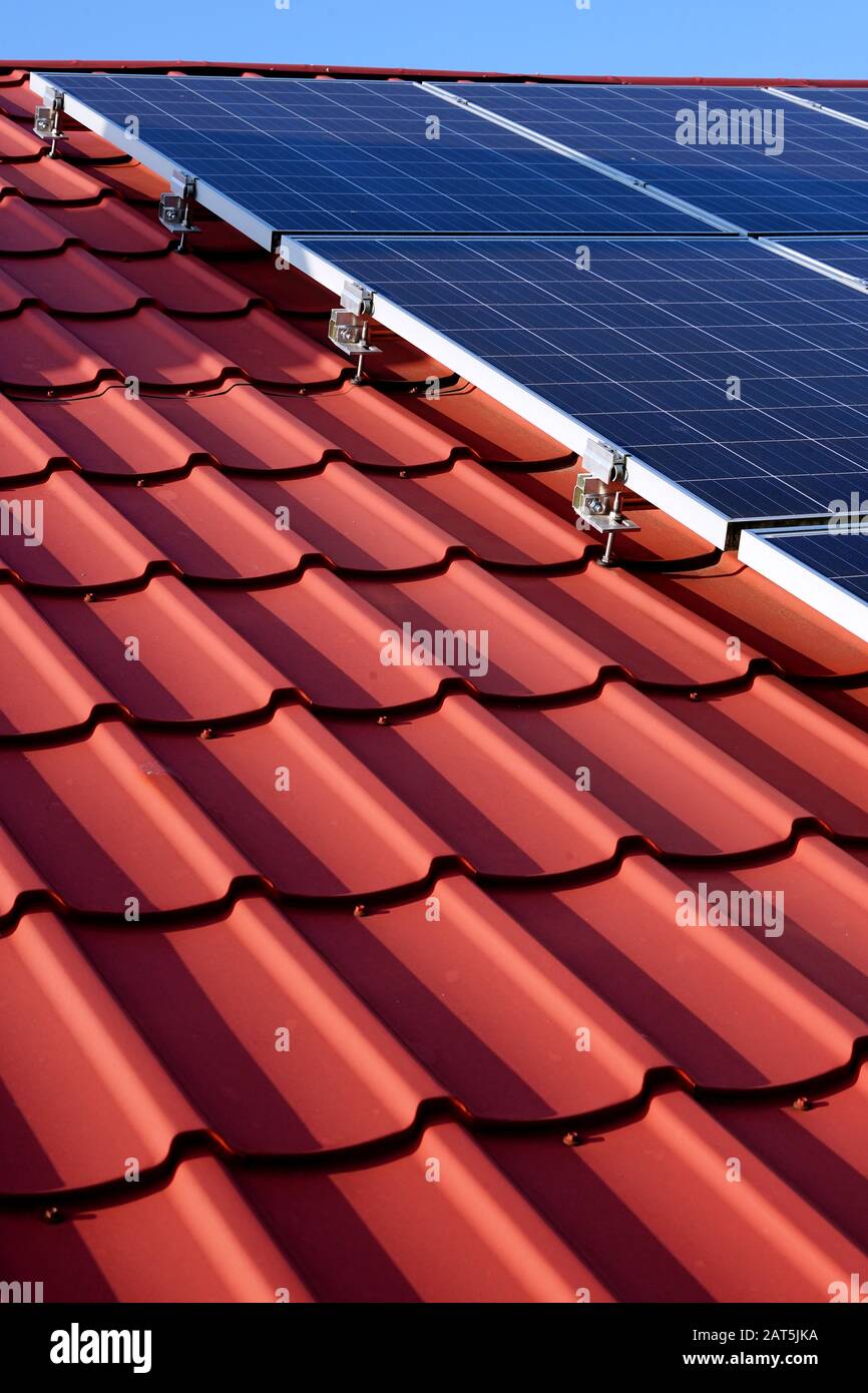 photovoltaic panels on the roof of a single-family house in the countryside Stock Photo