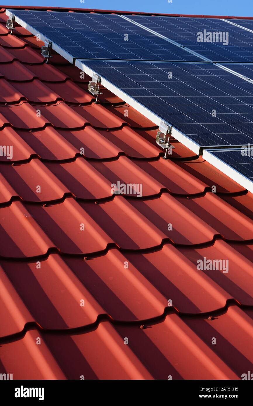 photovoltaic panels on the roof of a single-family house in the countryside Stock Photo