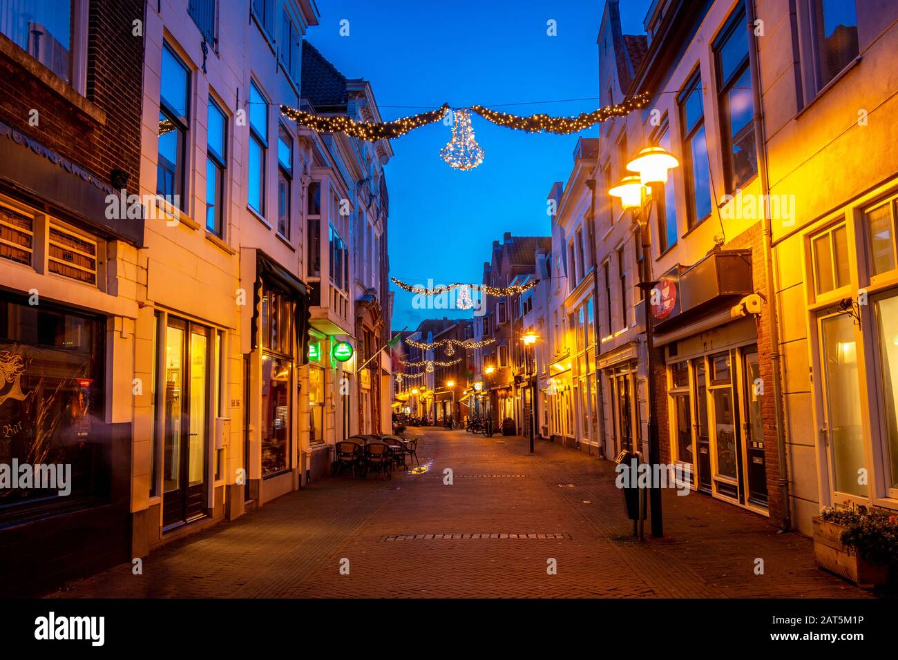 The center of Schiedam with beautiful narrow streets and small canals, photo taken in the evening hours with beautiful blue colors. Province south-Hol Stock Photo