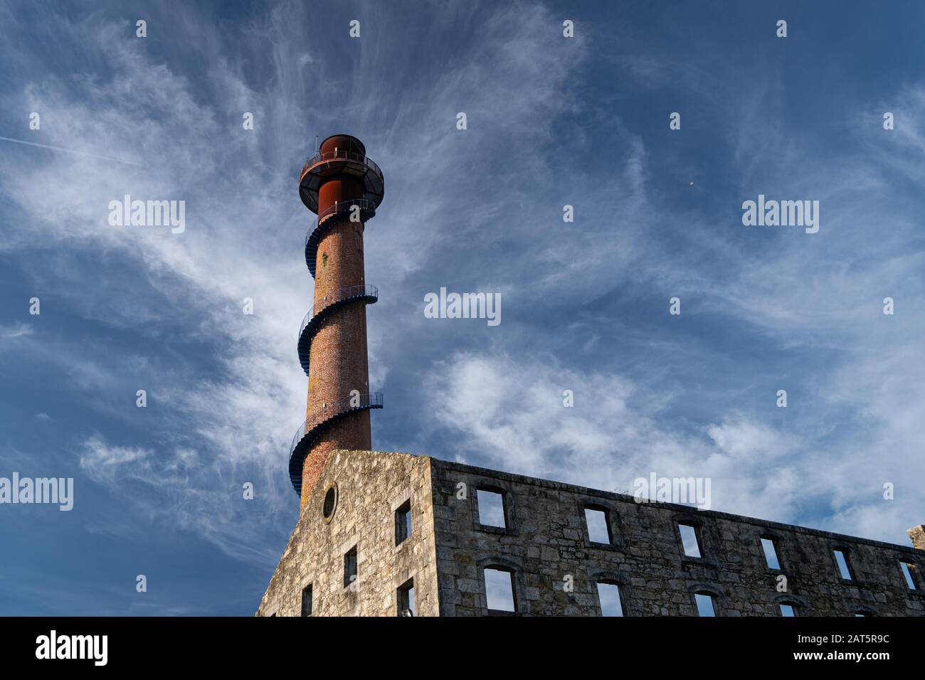 Ruins of a sugar factory from the beginning of the 20th century with a brick chimney rehabilitated as a tourist viewpoint. Caldas de Reyes, Galicia, S Stock Photo