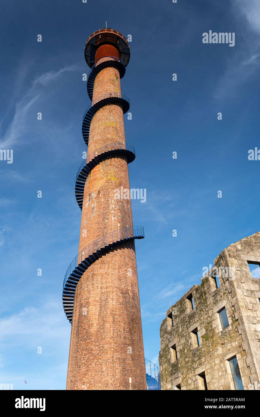 Ruins of a sugar factory from the beginning of the 20th century with a brick chimney rehabilitated as a tourist viewpoint. Caldas de Reyes, Galicia, S Stock Photo