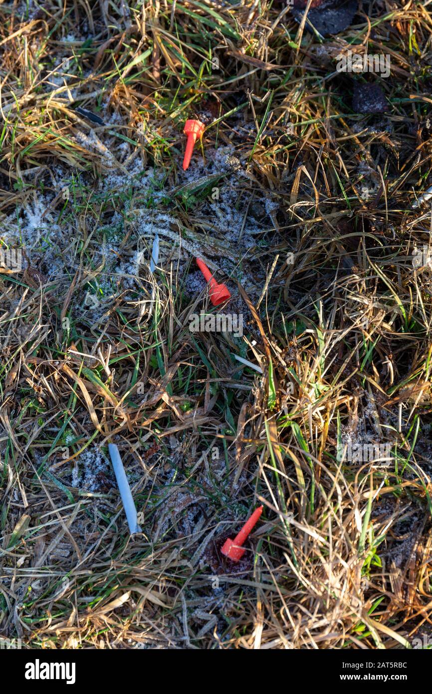 Plastic firework fuse covers on 1st of January after New Year's party Stock Photo