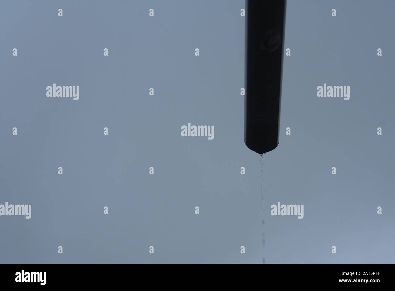 Pipe dripping rain water on a rainy day in Huaraz Peru Stock Photo Alamy