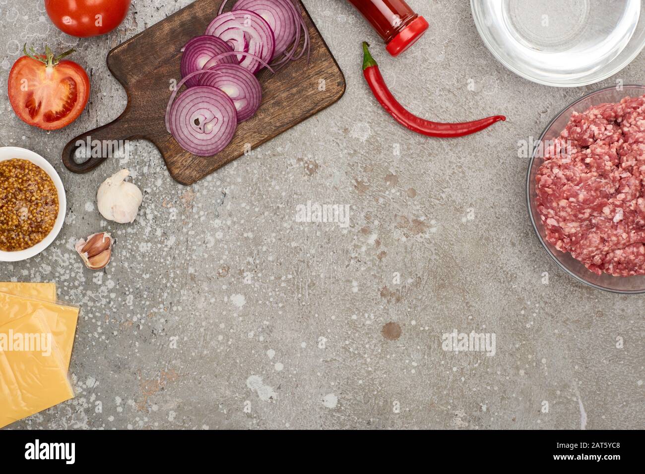 top view of fresh burger ingredients on grey concrete surface Stock ...
