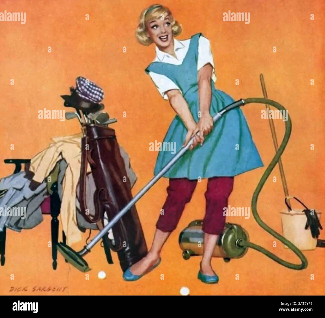 FIFTIES HOUSEWIFE WITH VACUUM Stock Photo