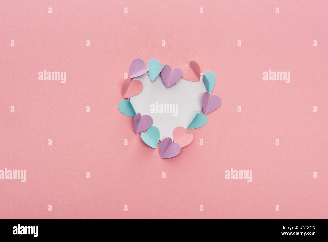 top view of colorful paper hearts as frame on pink background Stock ...
