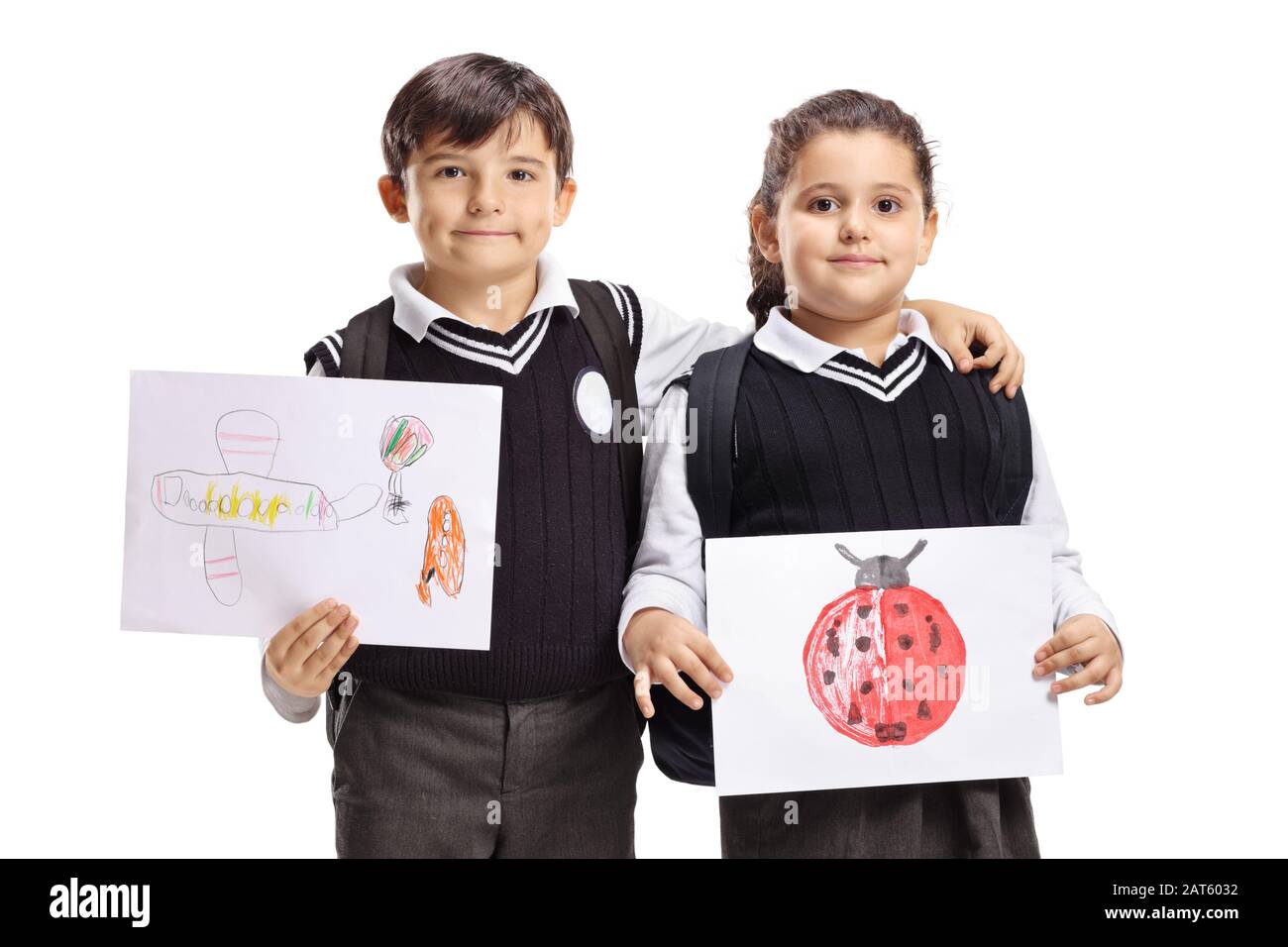 Schoolchildren holding drawings isolated on white background Stock Photo