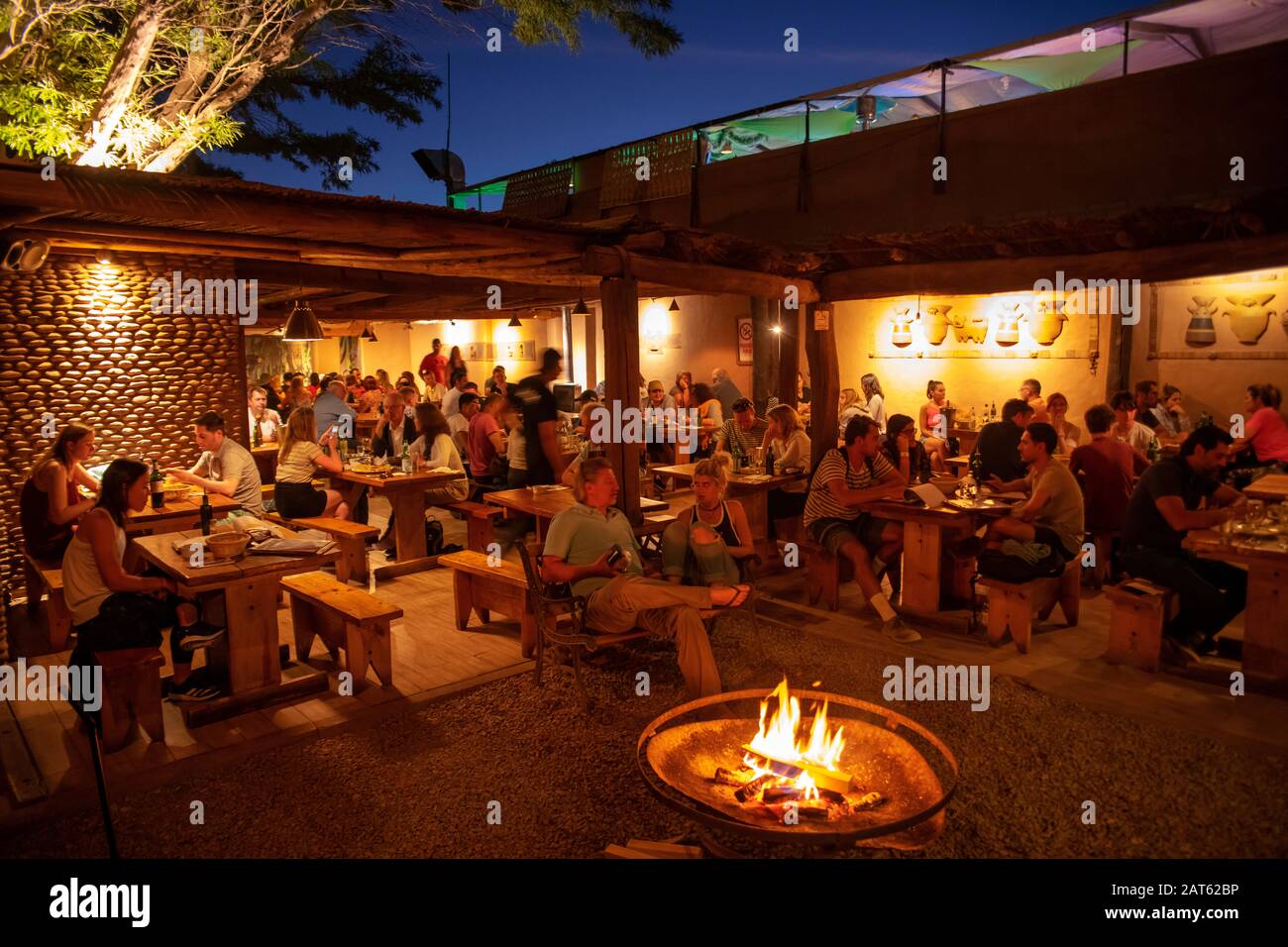 The busy Adobe restaurant at night,  San Pedro de Atacama, Atacama Desert, Antofagasta, Chile Stock Photo