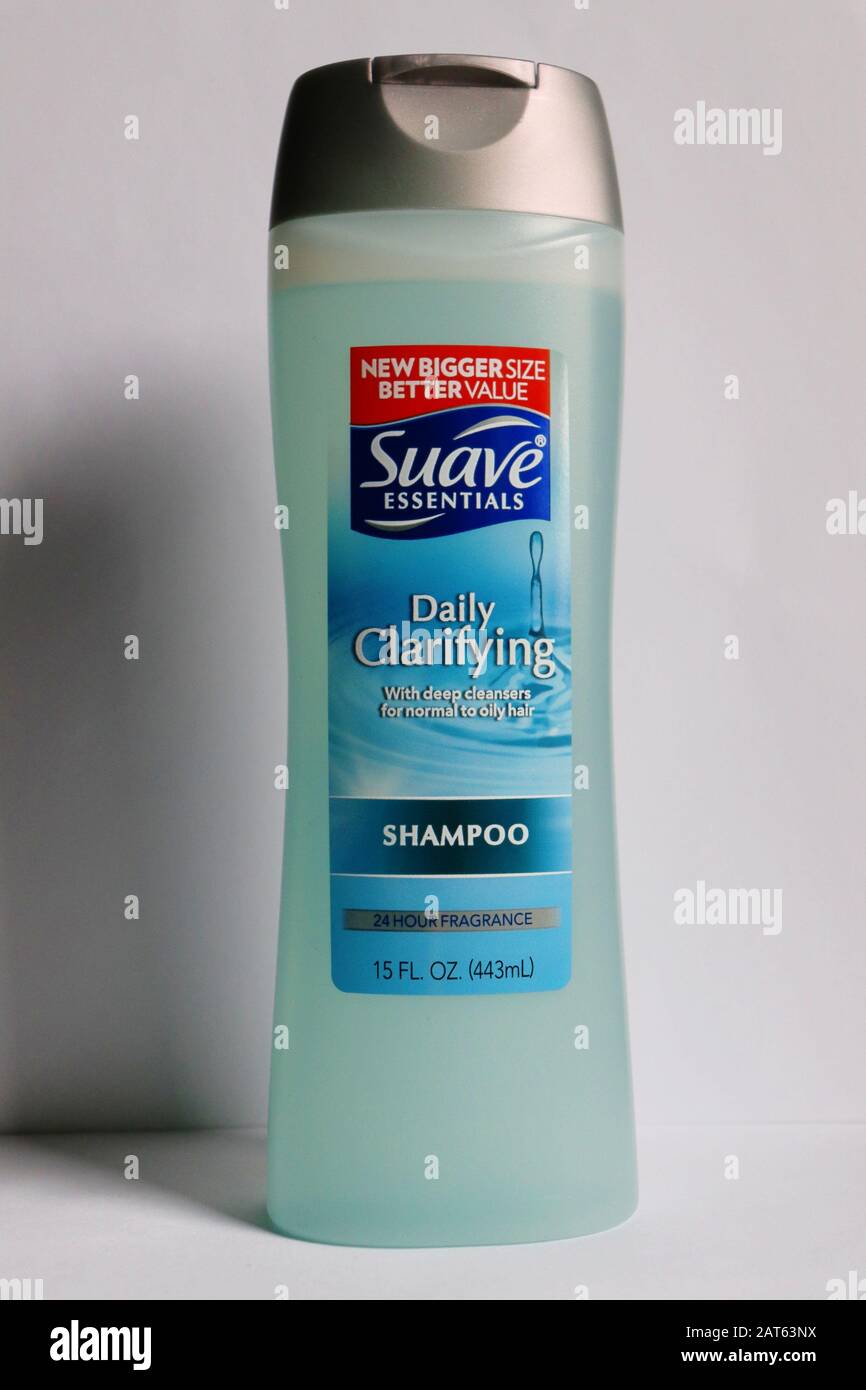 An unopened bottle of Suave shampoo with white background Stock Photo