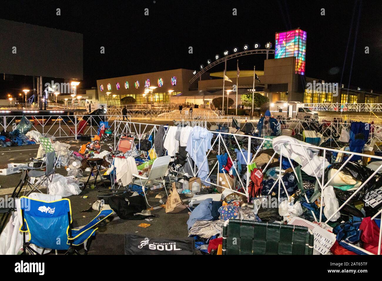 Chairs, blankets, and garbage left behind in the waiting and overflow area of the 'Keep America Great' rally; as seen after the event's completion. Stock Photo
