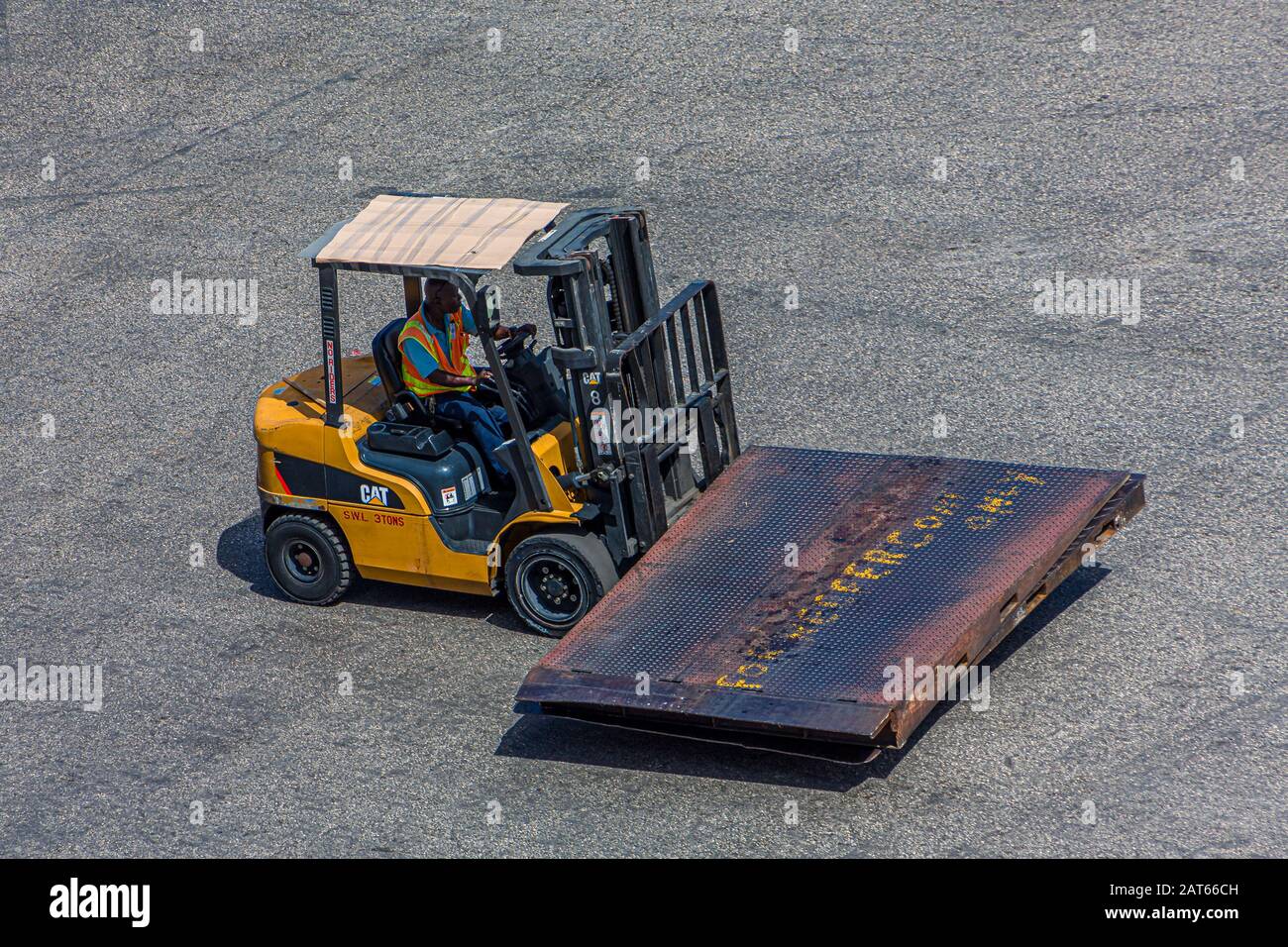 Dock Worker on Fork LIft Stock Photo Alamy