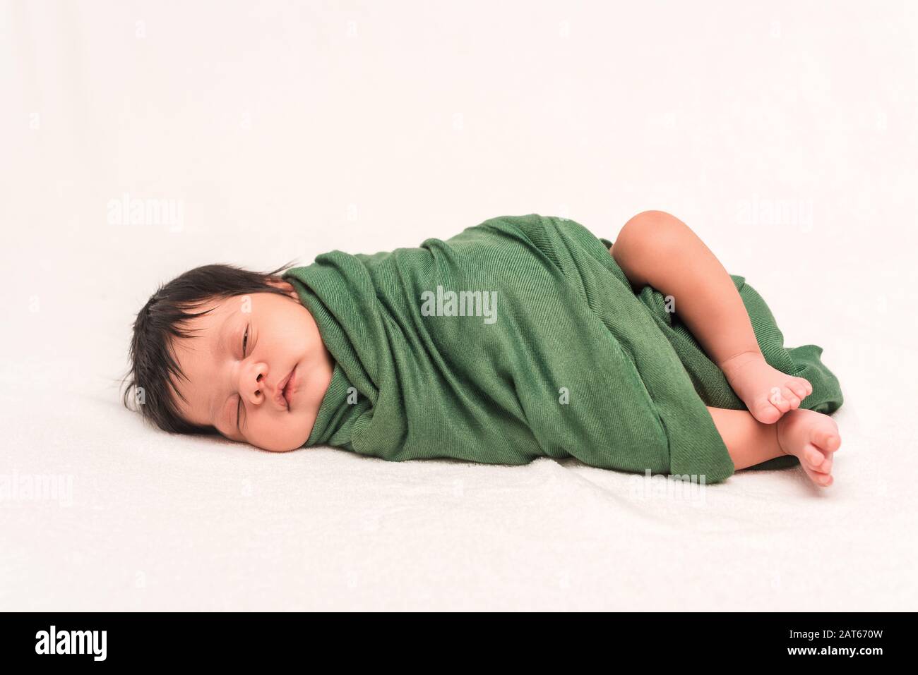 Baby Racial Newborn baby green blanket mixed race hi-res stock photography and ...