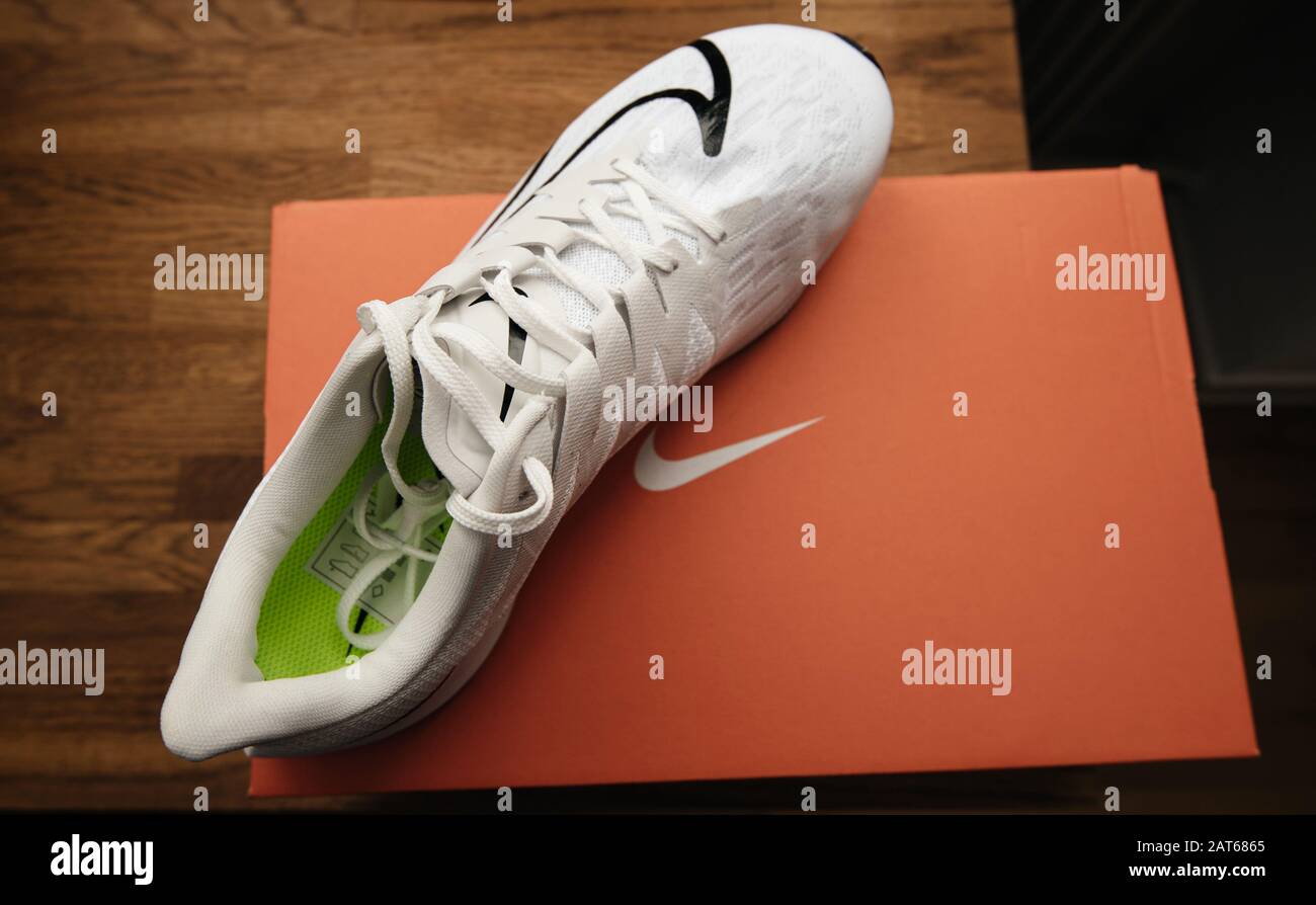 Paris, France - Sep 23, 2019: Overhead view on wooden store table of  unboxing process professional running shoe manufactured by Nike model Zoom  Rival Fly for women with black swoosh logo Stock Photo - Alamy