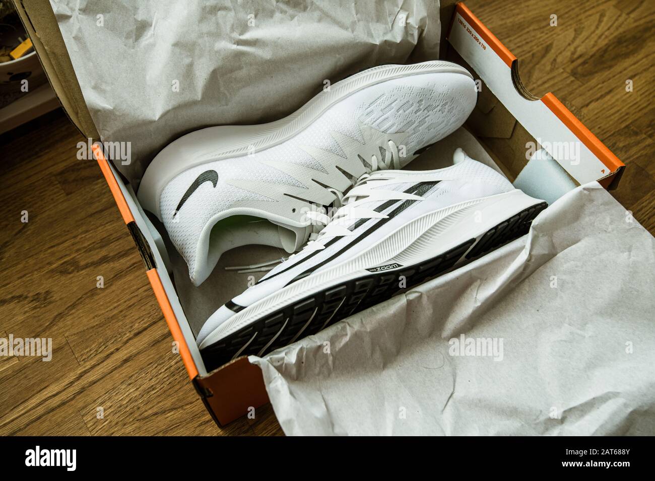 Paris, France - Sep 23, 2019: POV man hand over box performing the unboxing  unpacking of new pair of professional running shoes manufactured by Nike  Zoom Rival Fly for women Stock Photo - Alamy