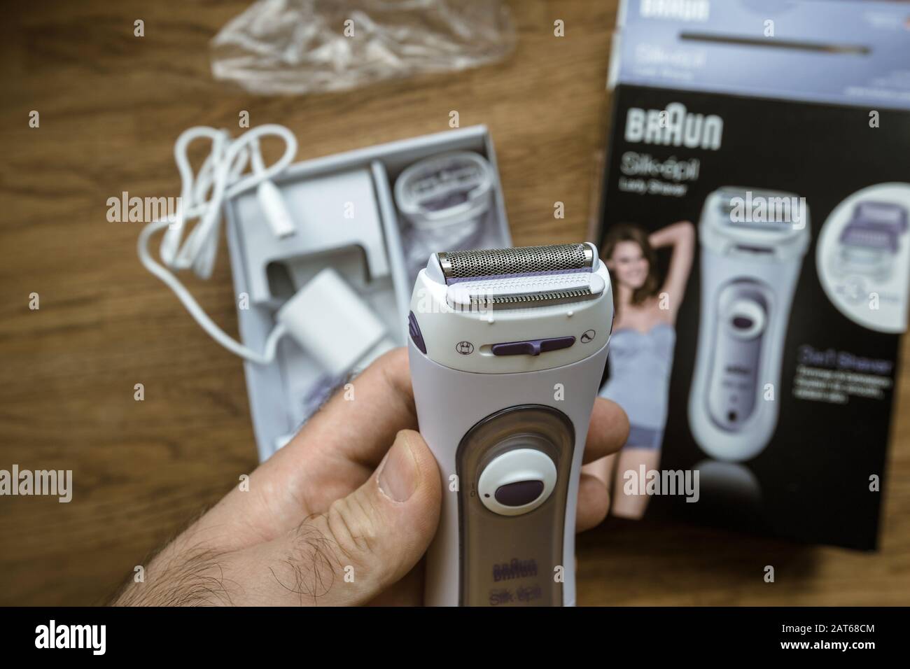 Paris, France - Sep 23, 2019: man POV hands holding female epilator Braun  Silk-Epil Lady Shaver inspecting the device after unboxing unpacking Stock  Photo - Alamy