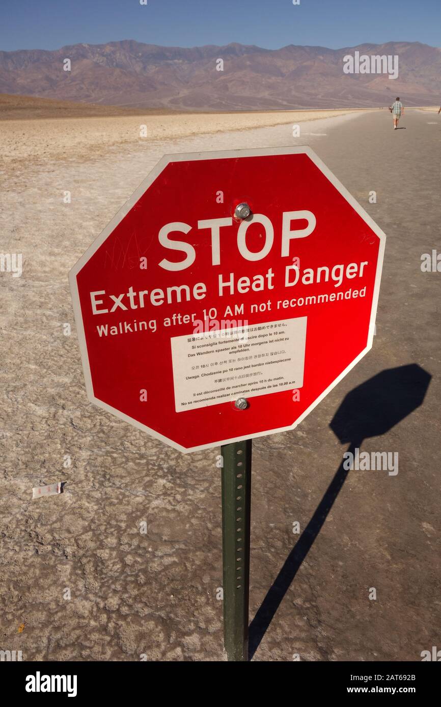A stop sign / danger sign / heat warnings sign at - Badwater Basin in Death Valley nationalpark USA - threat of high temperature , heat and dry area Stock Photo