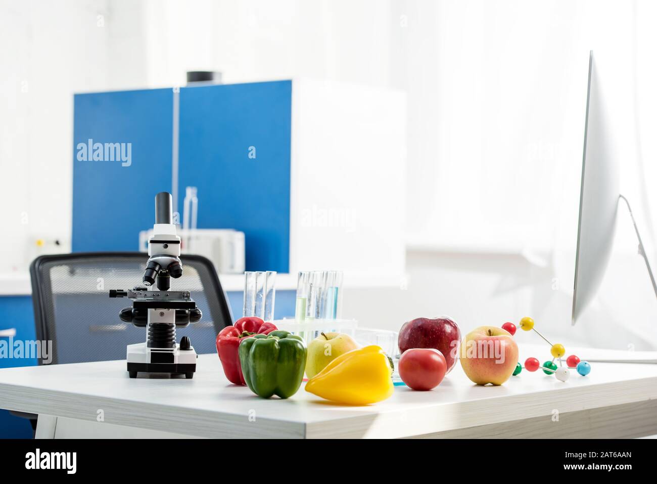 microscope, fruit, vegetables, test tubes on table in lab Stock Photo ...