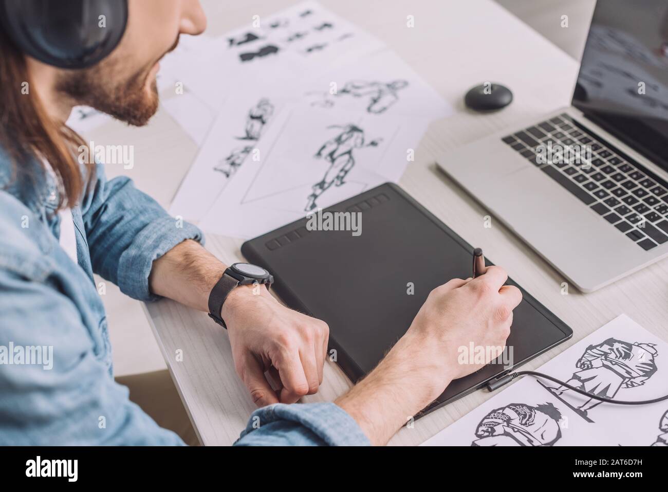 cropped view of animator in headphones using digital tablet Stock Photo