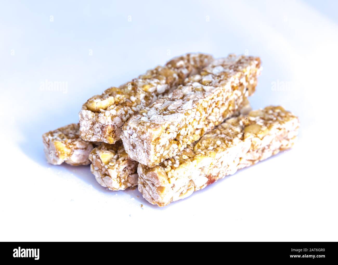 Pile of traditional Vietnamese peanut candy bars Keo Lac isolated Stock