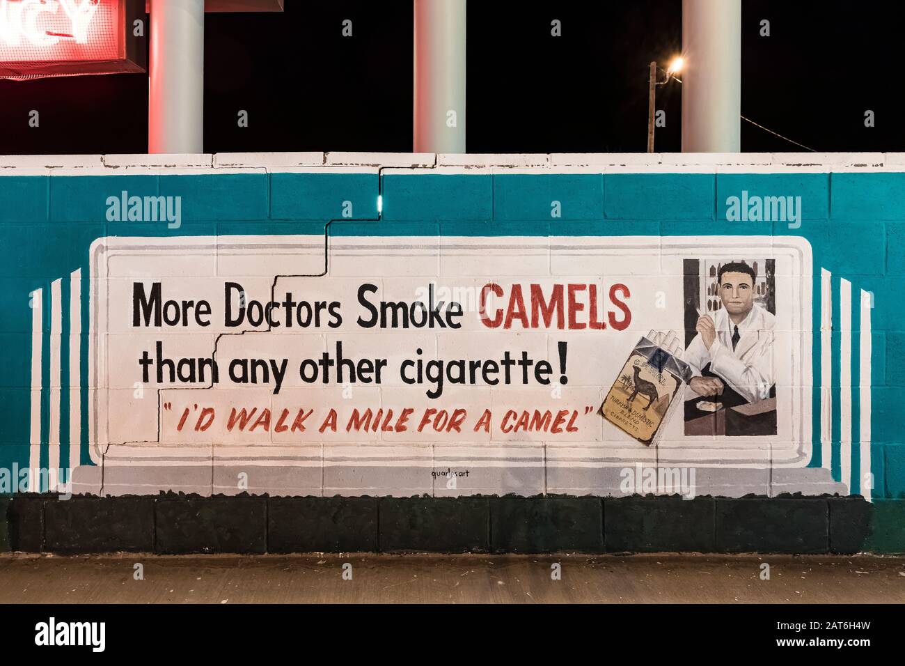 Reproduction of old Camel Cigarette ad by artist Doug Quarles at Motel Safari along Historic Route 66 in Tucumcari, New Mexico, USA [No property or co Stock Photo