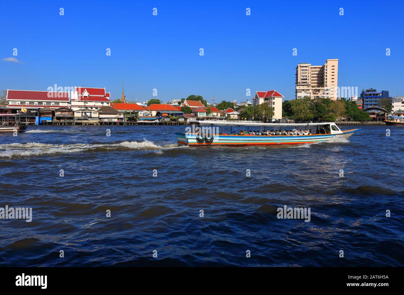 Bangkok, Thailand- January 28 2020: Traveling by boat to visit landmarks along Chao Phraya river is very popular for tourists Stock Photo