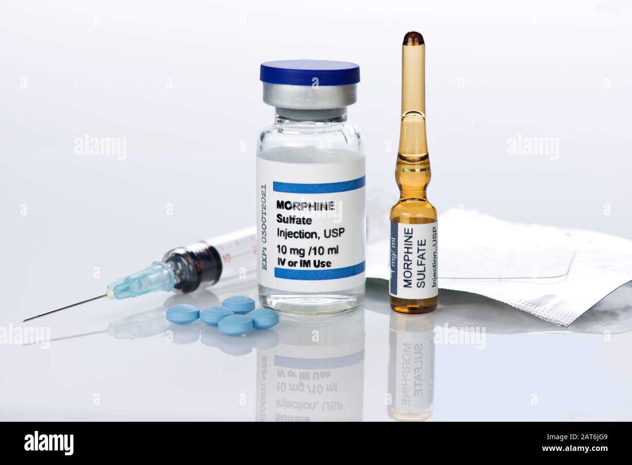 Morphine sulfate injection vial and ampule with morphine tablets, syringe and dermal patch. Stock Photo