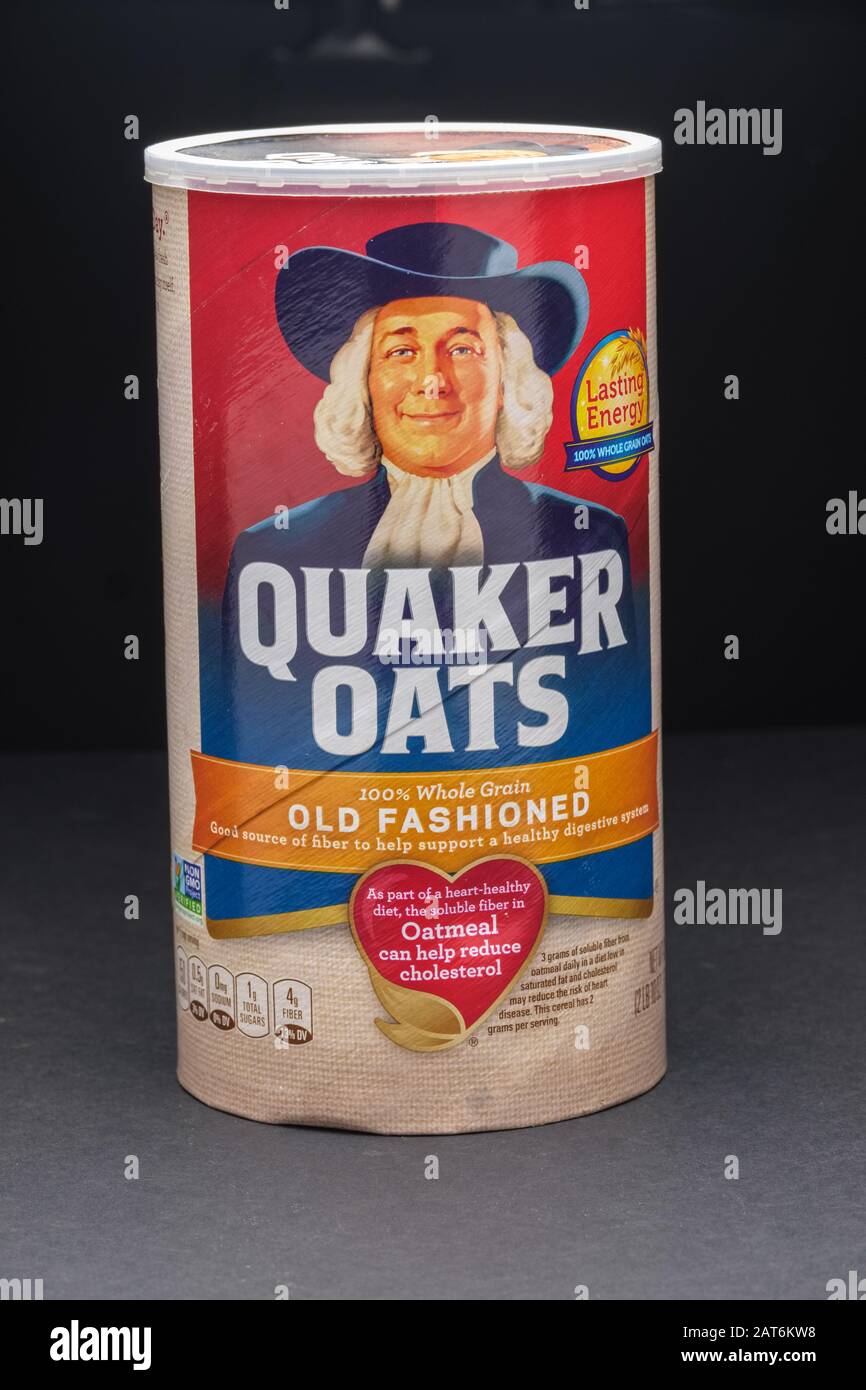 Round box of Quaker Oats used for  preparation of hot oatmeal on dark background Stock Photo