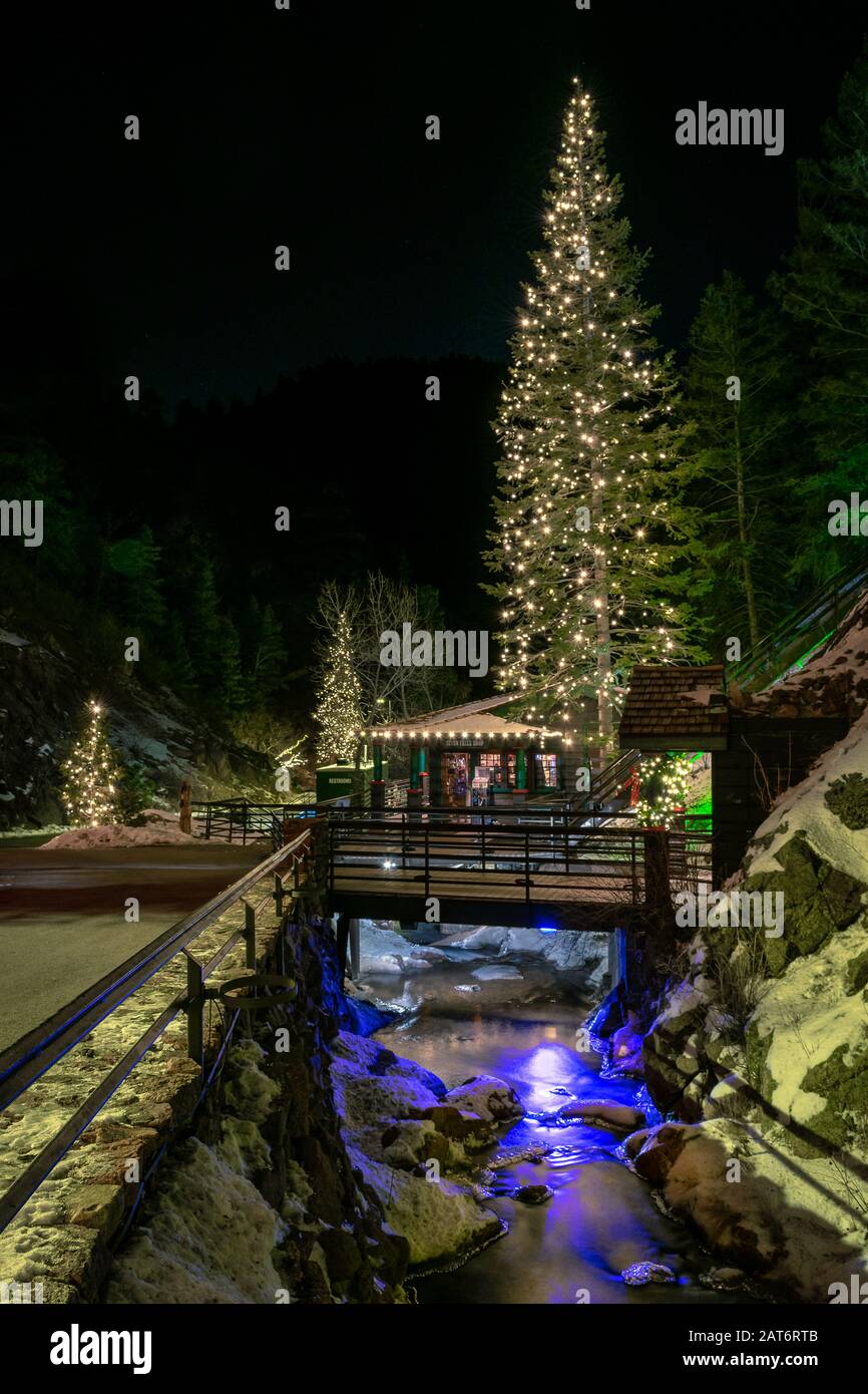 Seven Falls in Colorado Springs, CO, is a popular attraction during Christmas season known for its beautiful scenery and festive holiday light show. Stock Photo