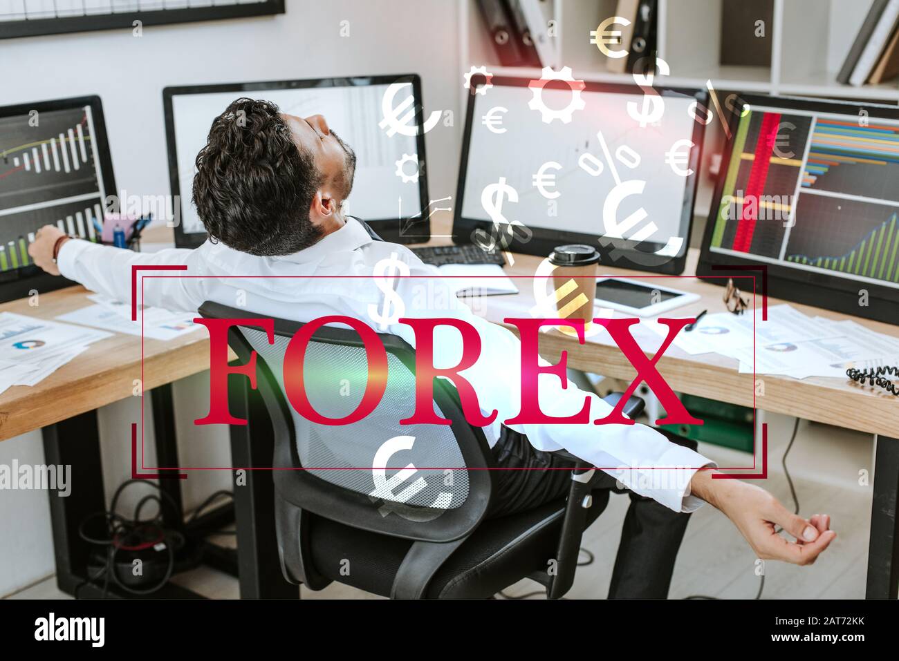 bi-racial trader with outstretched hands sitting near computers and ...