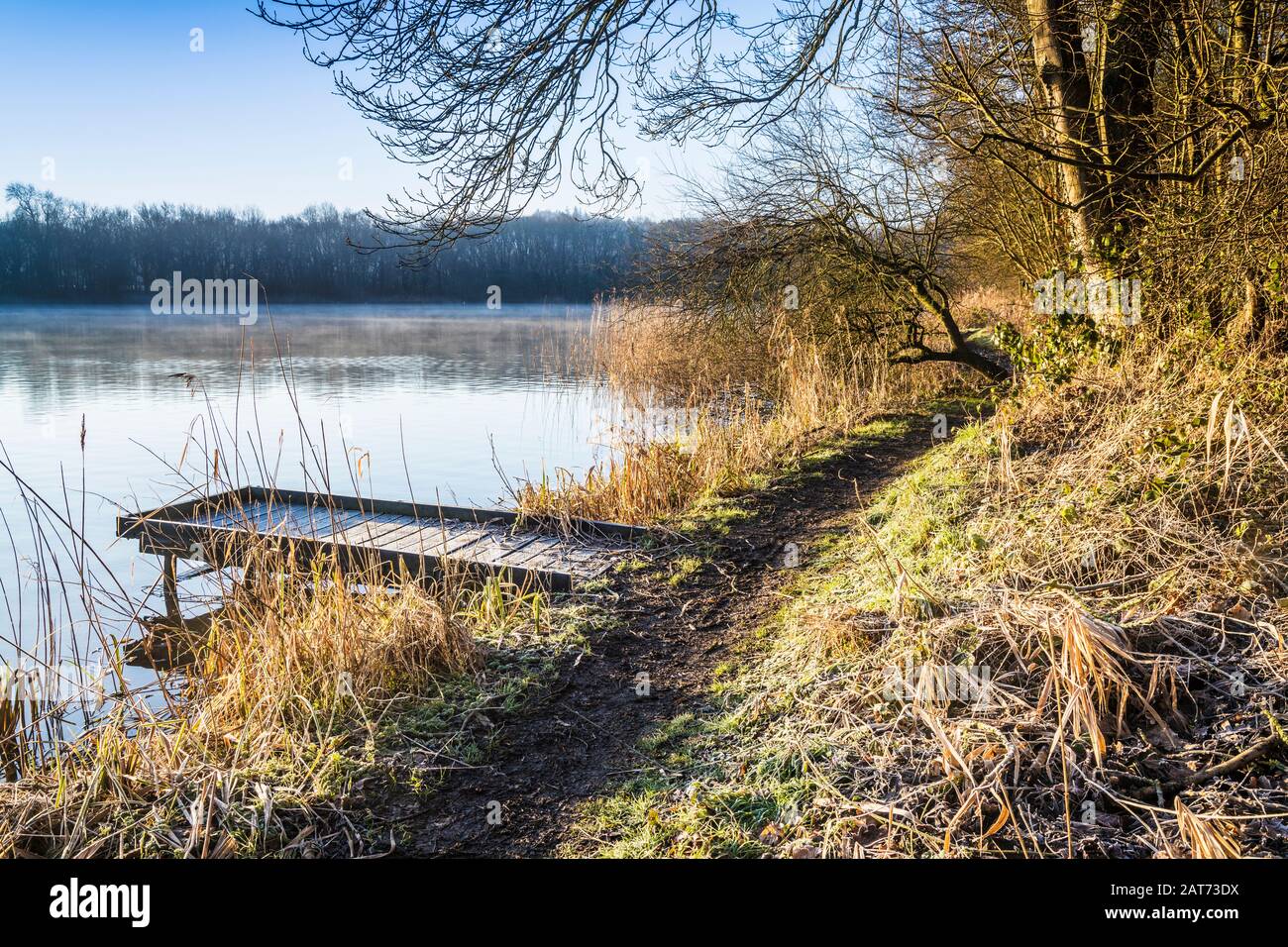 A cold, sunny winter's morning on Coate Water in Swindon. Stock Photo