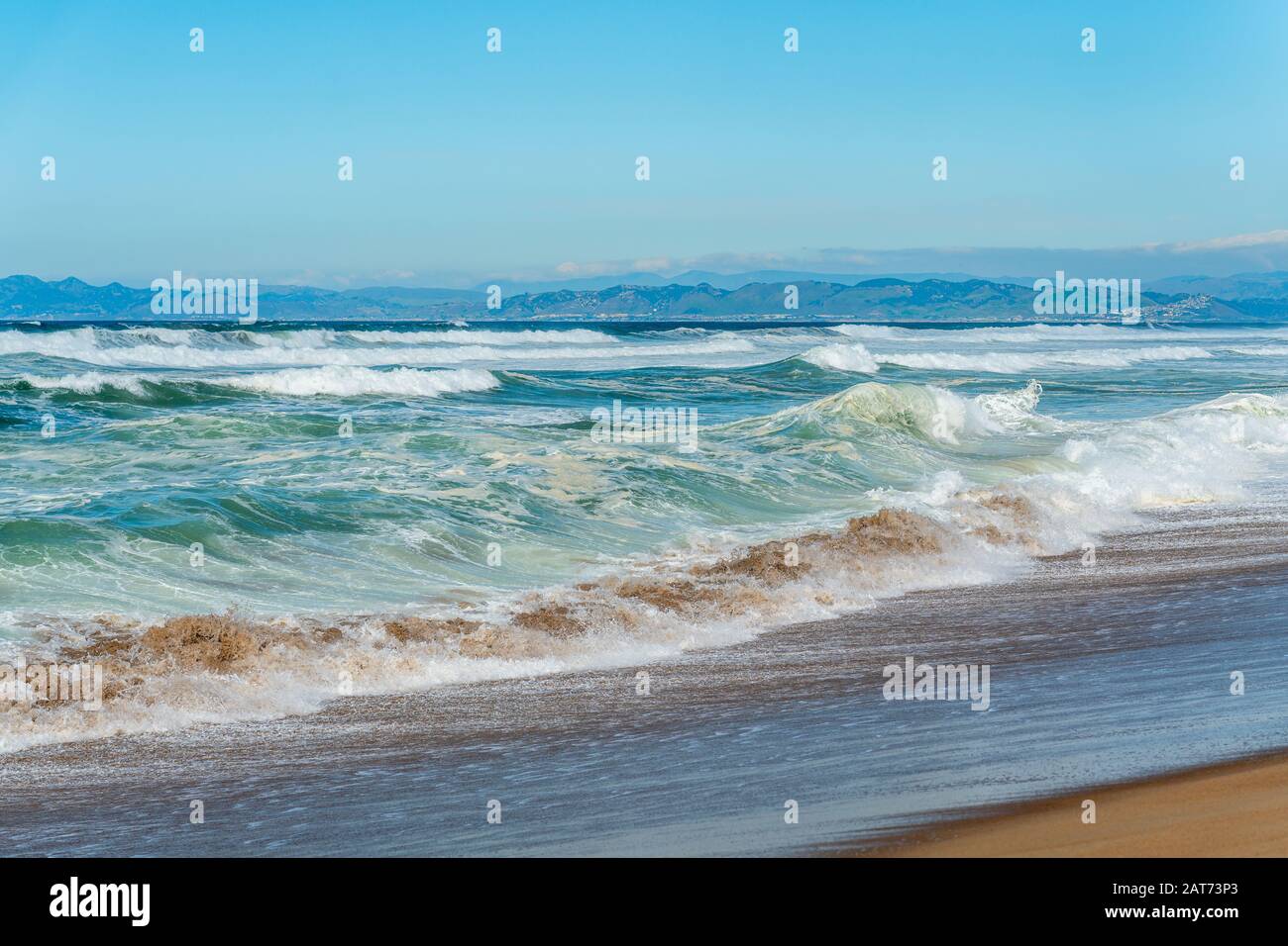 Beautiful seascape. Blue waves breaking on the shore. Stock Photo