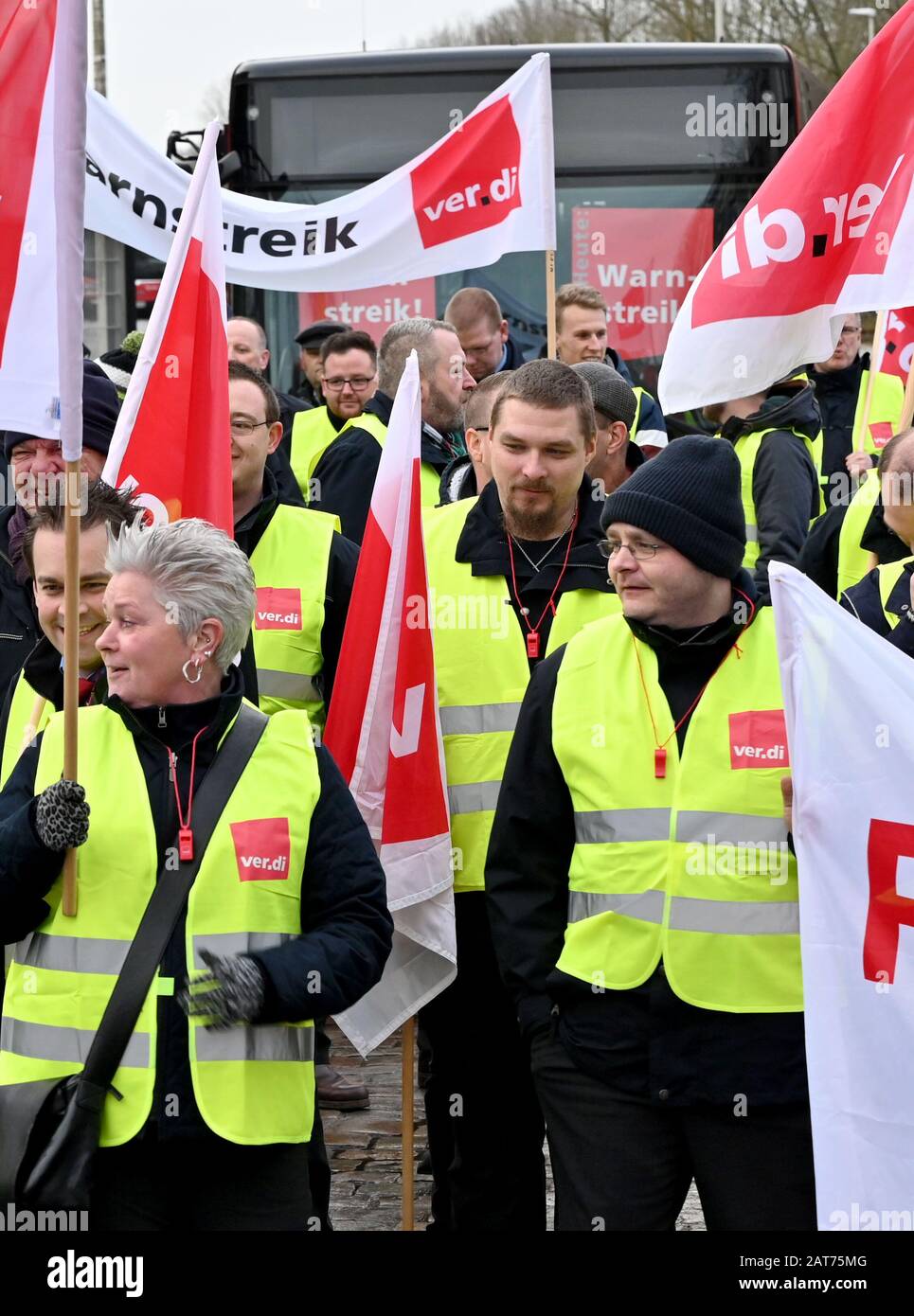 Kiel, Germany. 31st Jan, 2020. Striking bus drivers of the Kieler Verkehrs  Gesellschaft (KVG) start for a demonstration train. The trade union Verdi  had called for a two-day warning strike in public