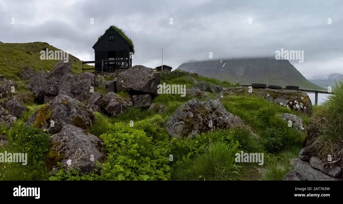 Typical Icelandic fishing village with grass-roofed homes and fish ...