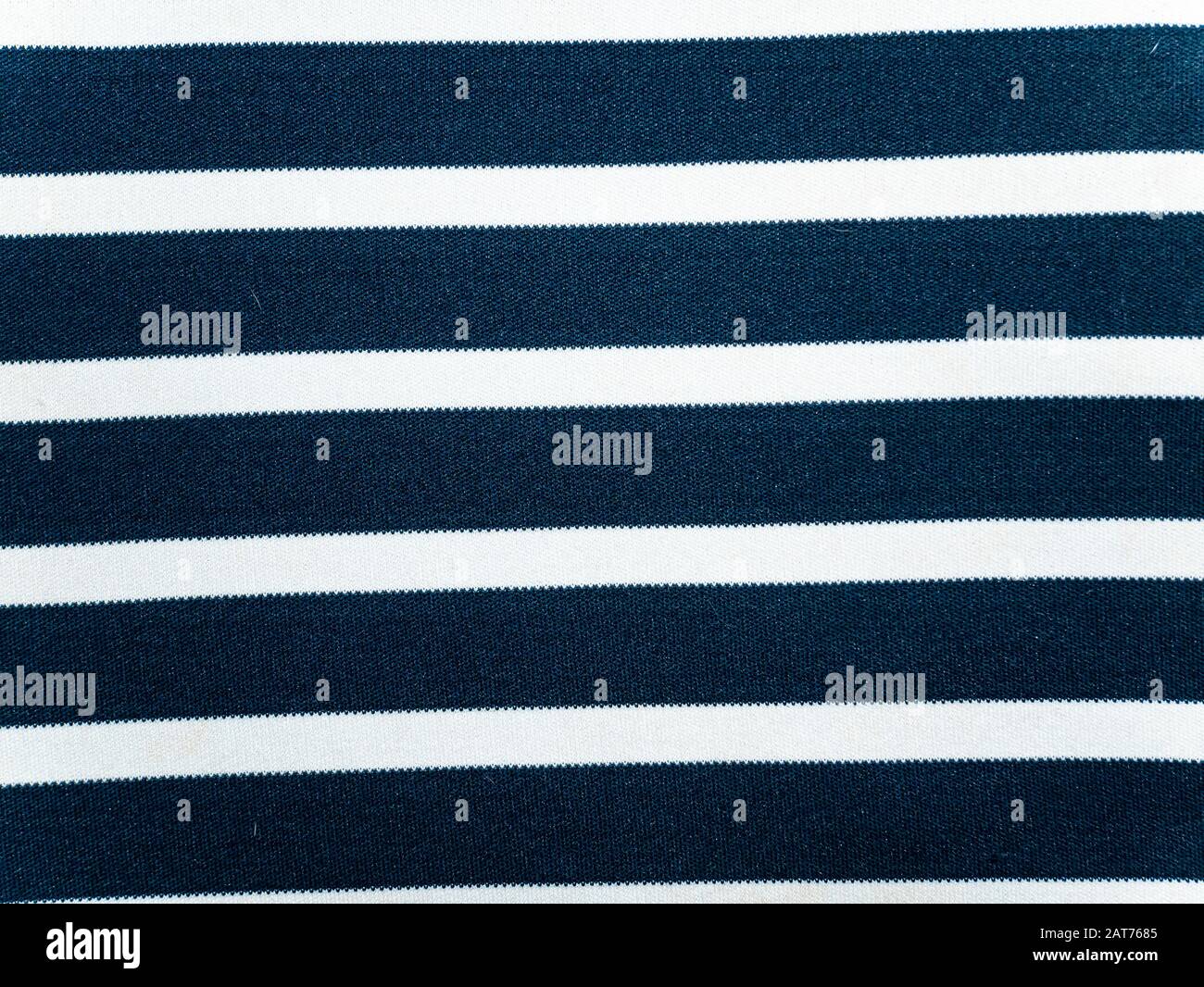 Texture of blue fabric with white stripes. Background image. Place for text. Stock Photo