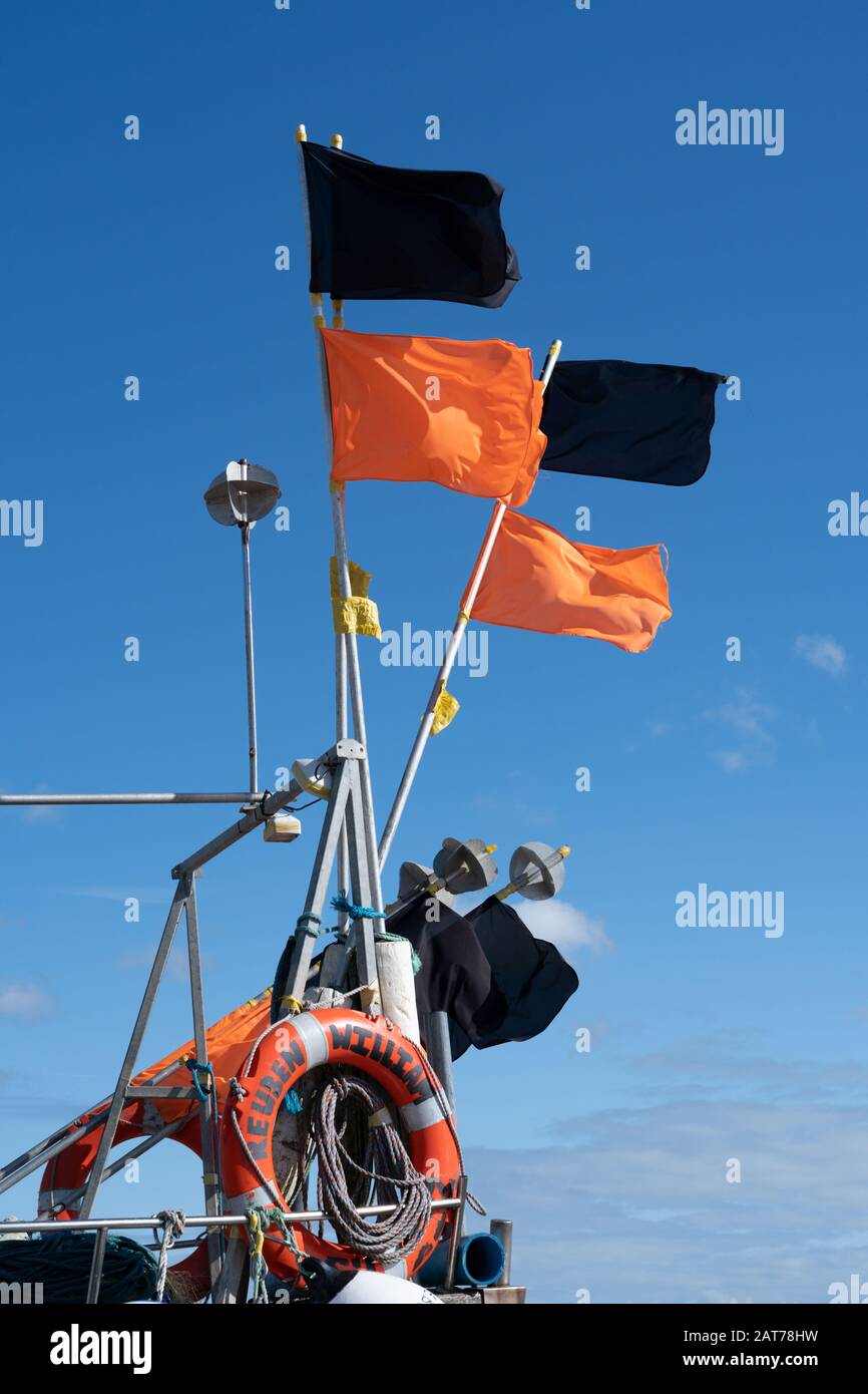 Buoy Flags on Fishing boat in Aldeburgh Beach Stock Photo