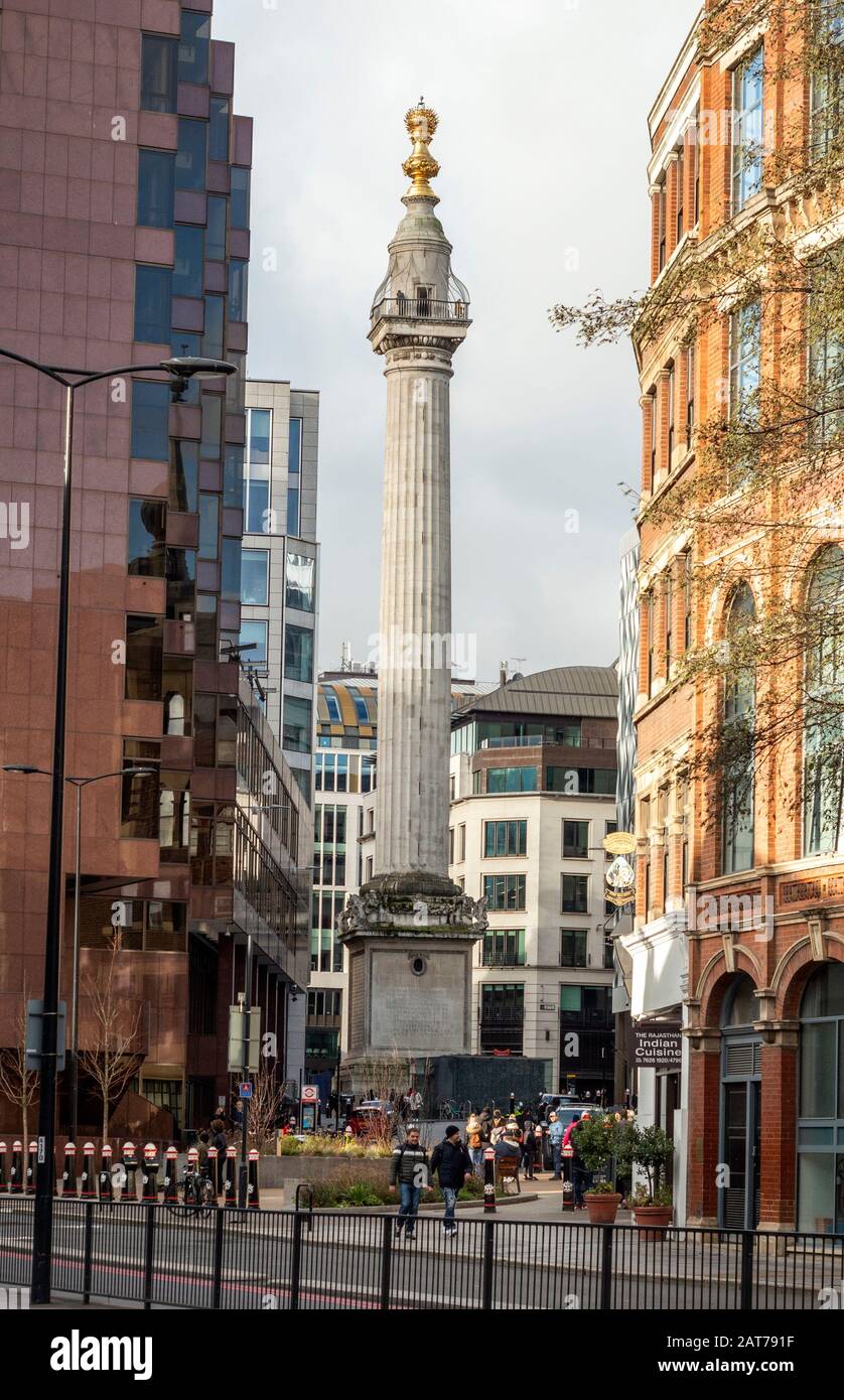 The Monument Memorial landmark as seen from the Lower Thames Street, London, UK Stock Photo