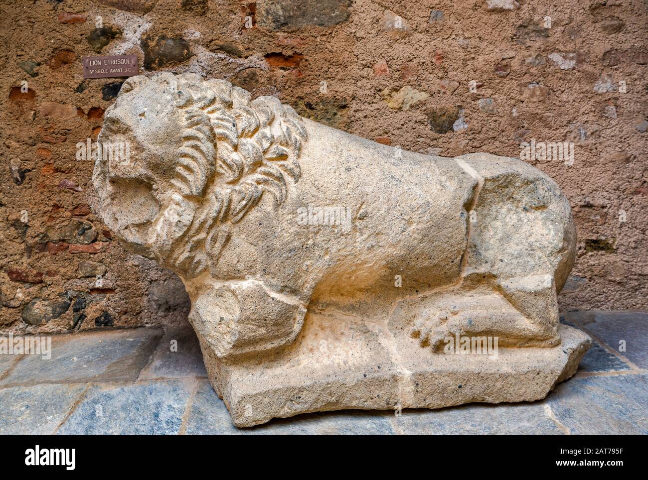 Etruscan sculpture of lion, 4th century BC, outside Musee Jerome-Carcopino at Fort de Matra in Aleria, Haute-Corse, Corsica, France Stock Photo