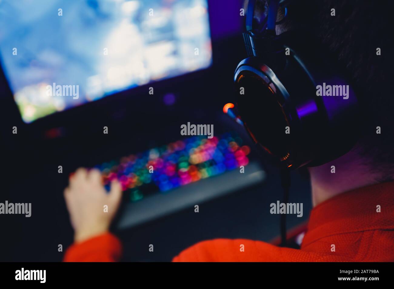 Professional gamer playing online games tournaments pc computer with