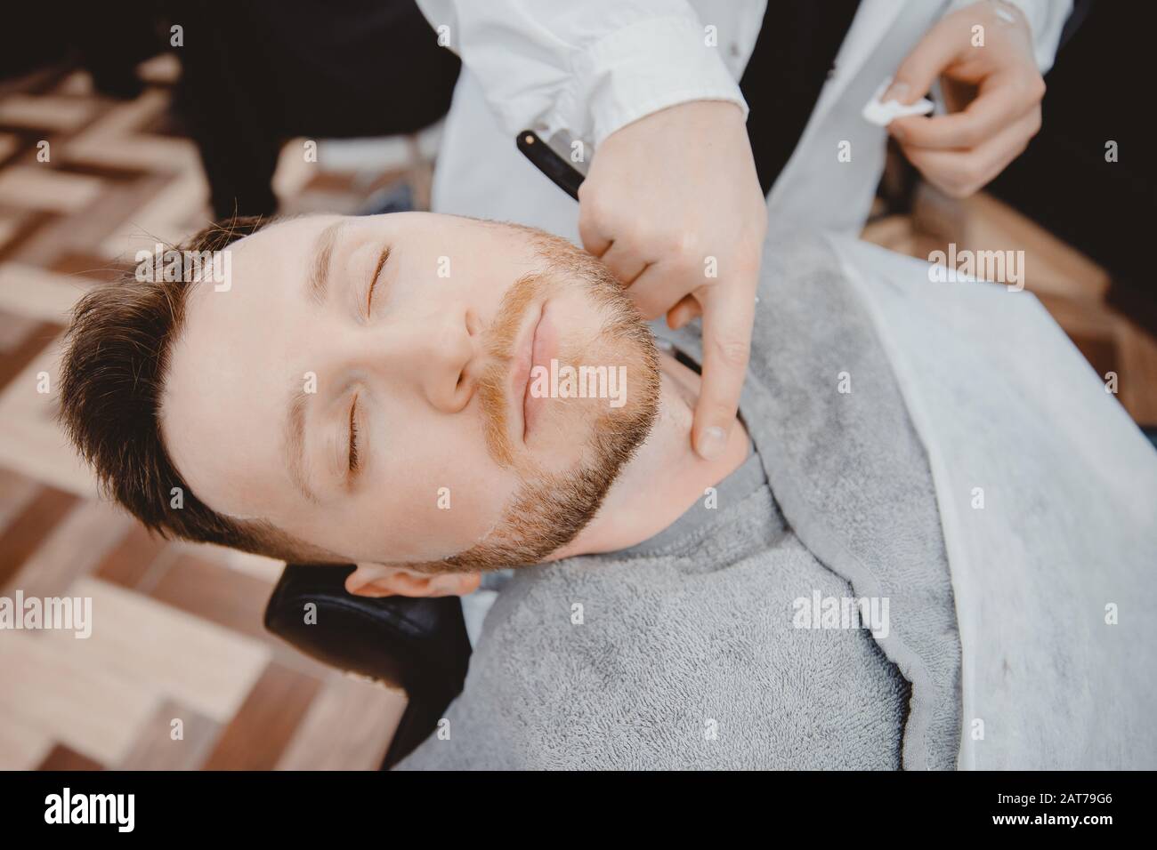 Barber process shaving razor bearded hipster man in barbershop Stock ...