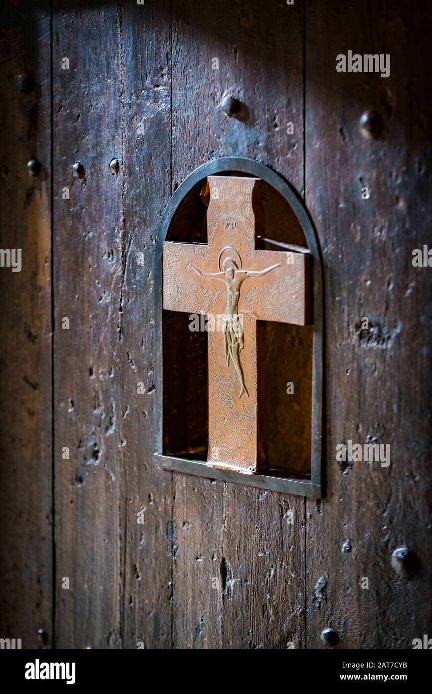 Wooden door with a metal crucifix of Jesus Christ Stock Photo Alamy