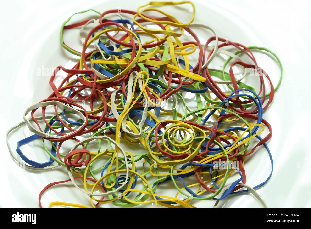 Elastic multicolored elastic bands lie on a table Stock Photo