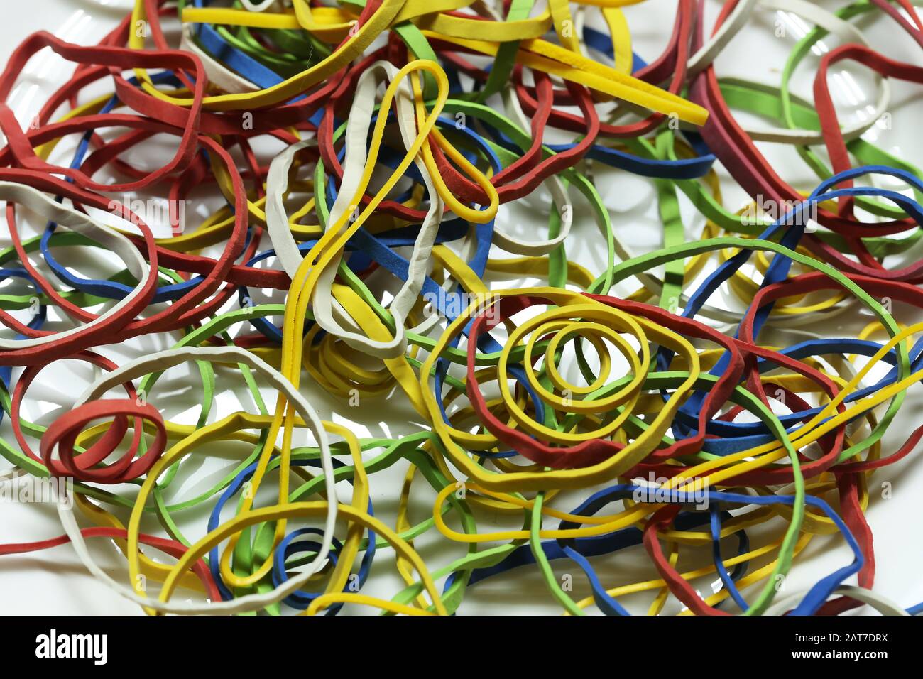 Elastic multicolored elastic bands lie on a table Stock Photo